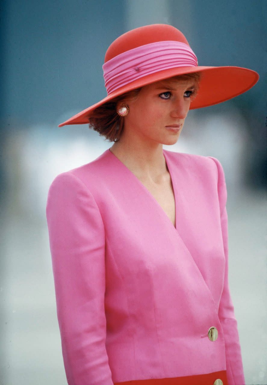 KUWAIT - MARCH 14: DIANA, PRINCESS OF WALES, DURING HER OFFICIAL TOUR OF KUWAIT THE PRINCESS IS WEARING A PINK AND RED CLASHING COLOURS COAT DRESS DESIGNED BY CATHERINE WALKER WITH A MATCHING HAT BY PHILIP SOMERVILLE (Photo by Tim Graham Photo Library via Getty Images)