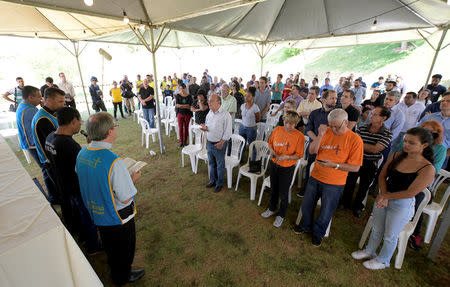 Residents attend an ecumenical service in memory of victims of a collapsed tailings dam owned by Brazilian mining company Vale SA, in Brumadinho, Brazil January 31, 2019. REUTERS/Washington Alves