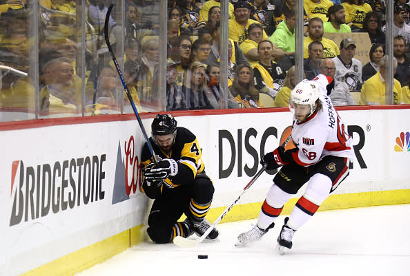 PITTSBURGH, PA - MAY 15: Justin Schultz #4 of the Pittsburgh Penguins kneels on the ice in pain after being checked by Mike Hoffman #68 of the Ottawa Senators during the first period in Game Two of the Eastern Conference Final during the 2017 NHL Stanley Cup Playoffs at PPG PAINTS Arena on May 15, 2017 in Pittsburgh, Pennsylvania. (Photo by Bruce Bennett/Getty Images)