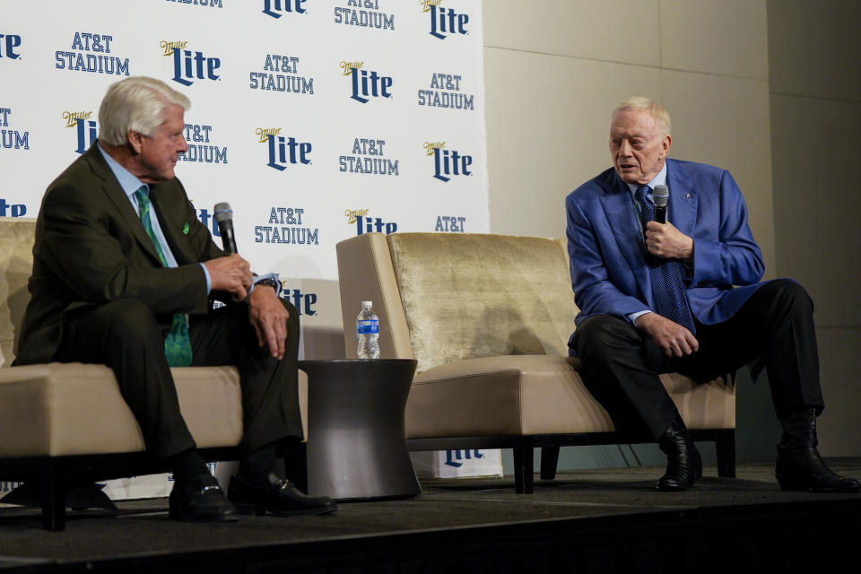 Pro Football Hall of Fame coach Jimmy Johnson, left, speaks during a news conference with Dallas Cowboys owner Jerry Jones prior to an NFL football game between the Cowboys and the Detroit Lions, Saturday, Dec. 30, 2023, in Arlington, Texas. Johnson will be inducted into the team's ring of honor during a halftime ceremony. (AP Photo/Sam Hodde)