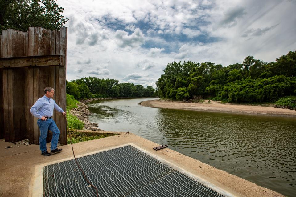 Des Moines Water Works CEO and General Manager Ted Corrigan stands above the water intake at the Raccoon River Thursday, July 30, 2020.