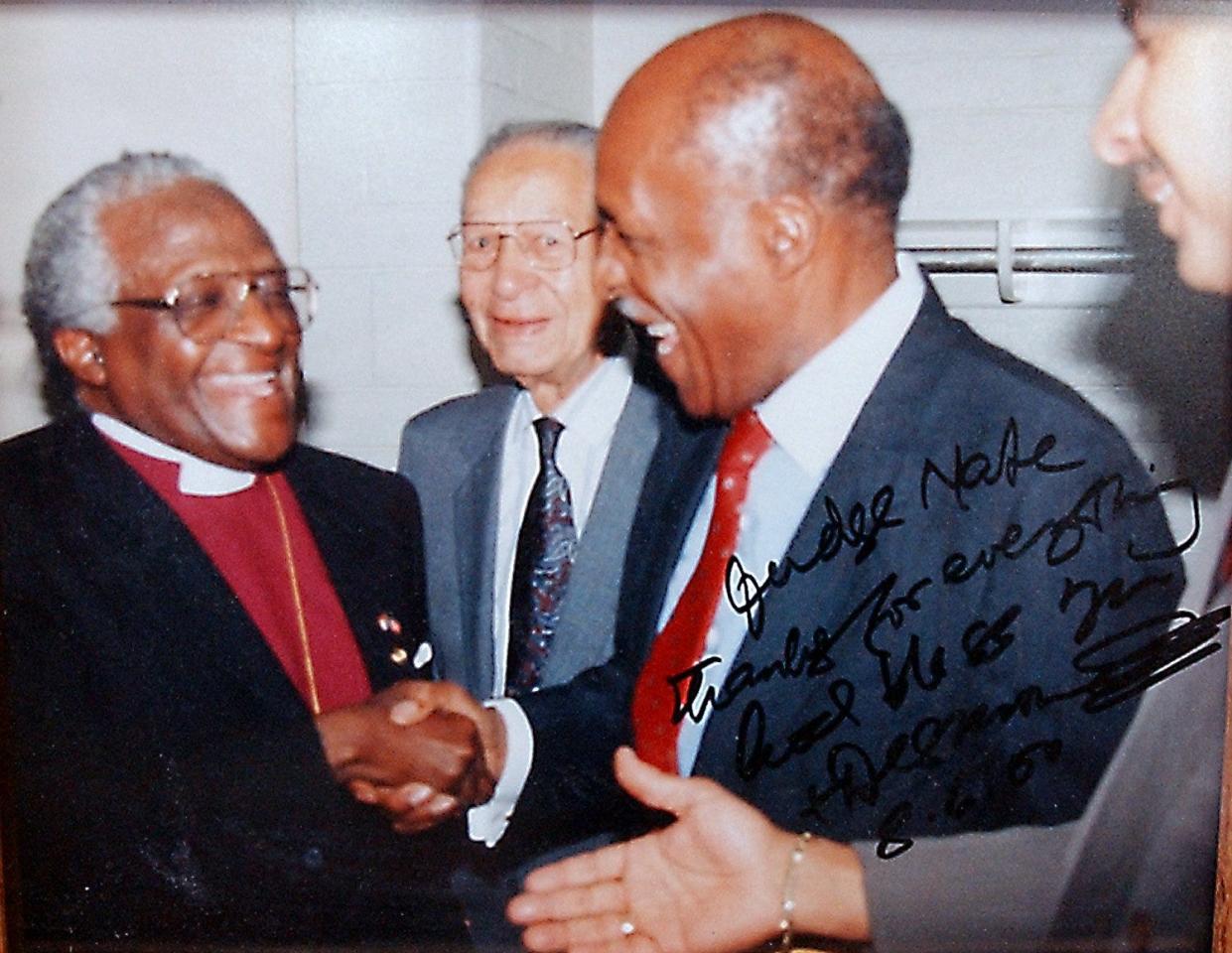 January 4, 2002: Judge Nathaniel R. Jones is retiring as a Judge on the US Court of Appeals in Cincinnati. Here is a copy of a photo of him with Archbishop Desmond Tutu, Former Cincinnati Mayor Theodore Berry and Mayor Berry's son Ted. Photo by Glenn Hartong/The Cincinnati Enquirer.