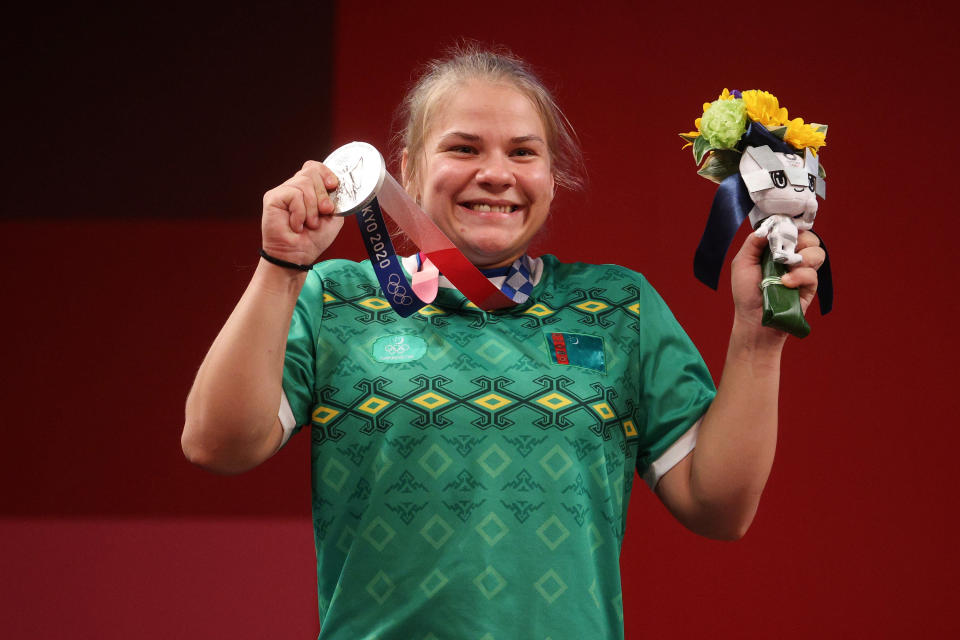 Polina Guryeva of Team Turkmenistan poses with the silver medal