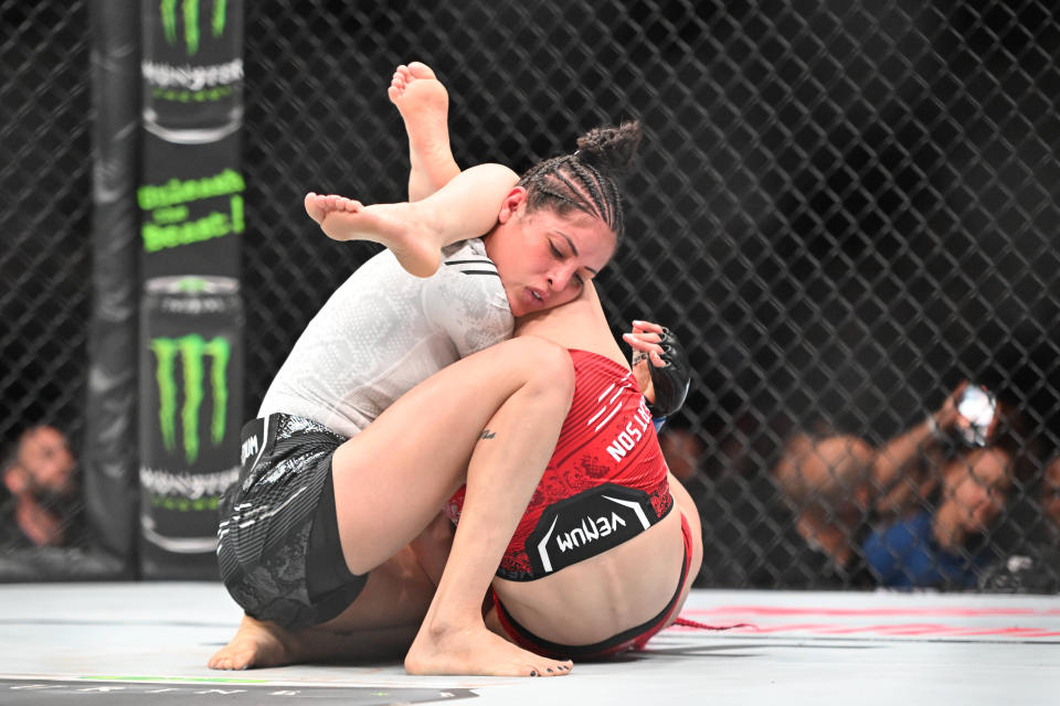 Jan 20, 2024; Toronto, Canada, USA; Gillian Robertson (red glove) fights Polyana Viana (blue gloves) during UFC 297 at ScotiaBank Arena. Mandatory Credit: Dan Hamilton-USA TODAY Sports