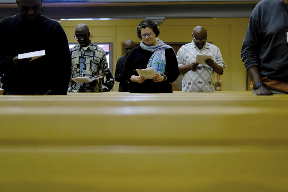 Beth Stroud, center, attends a service at Turning Point United Methodist Church in Trenton, N.J. on Sunday, May 12, 2024. Stroud was defrocked from her job as a United Methodist pastor in Philadelphia 20 years ago. In a church trial, she was found guilty of violating Christian teaching because she acknowledged living in a committed relationship with another woman. Earlier this month, delegates at a United Methodist conference struck down longstanding anti-LGBTQ bans and created a path for clergy ousted because of them to seek reinstatement. (AP Photo/Luis Andres Henao)