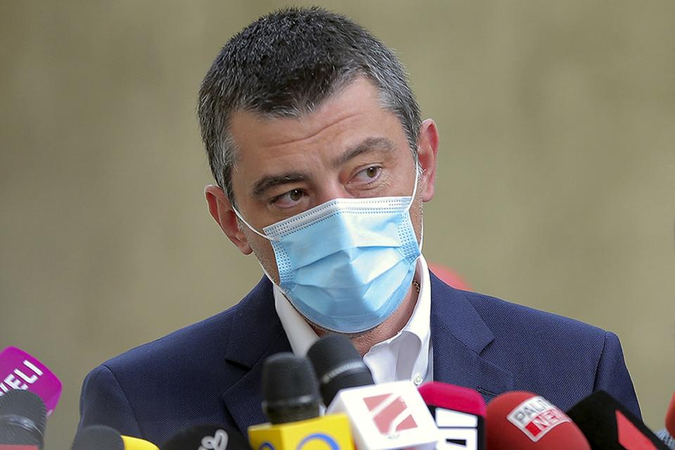 FILE - In this file photo released on Oct. 31, 2020, by Georgia's Prime Minister Press Office, Georgia's Prime Minister Giorgi Gakharia, wearing a face mask to help curb the spread of the coronavirus, speaks to the media after voting at a polling station during the parliamentary elections in Tbilisi, Georgia. Gakharia announced his resignation Thursday, Feb. 18, 2021 following a court ruling that ordered the arrest of a man who leads the ex-Soviet nation's top opposition party. (Georgian Prime Minister Press office via AP, File)