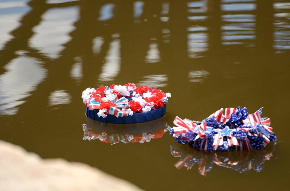Memorial wreaths float on the lagoon at Elm Park following the Veteran's Council and City of Worcester Veterans' Services Department annual Water Ceremony in observance of Memorial Day on Sunday in Worcester.