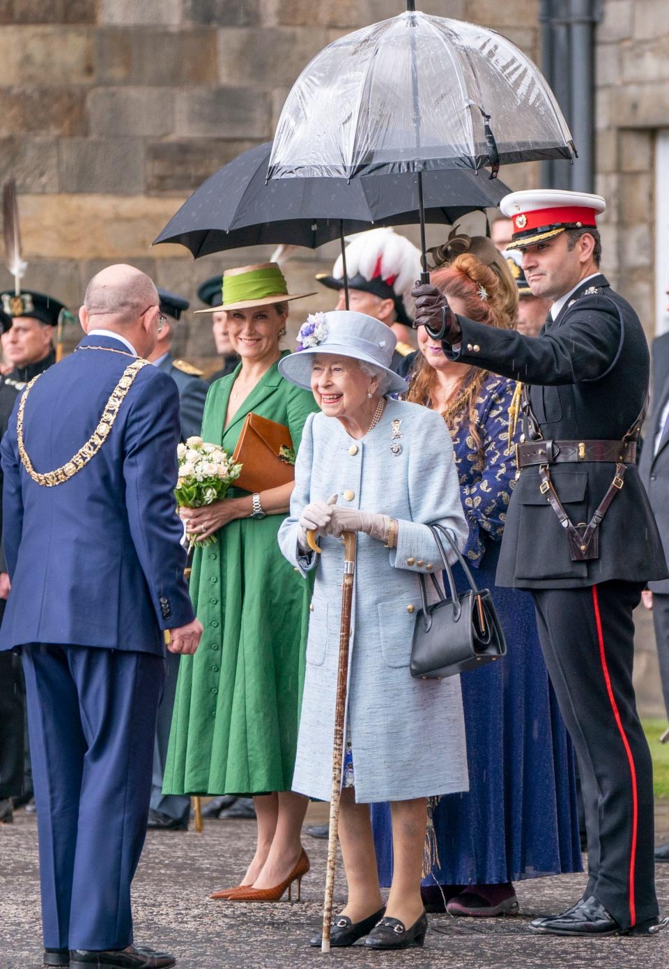 The Queen beamed despite the rain, as she was accompanied by the Earl and Countess of Wessex - Jane Barlow 