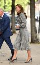 <p>Kate re-wore a <a href="https://www.townandcountrymag.com/society/tradition/a37864400/kate-middleton-black-white-dress-early-years-photos/" rel="nofollow noopener" target="_blank" data-ylk="slk:black and white plaid Zara dress;elm:context_link;itc:0;sec:content-canvas" class="link ">black and white plaid Zara dress</a> to meet with researchers at University College of London. She paired the midi dress with grey pointed toe pumps and wore her hair in her signature loose waves. </p>