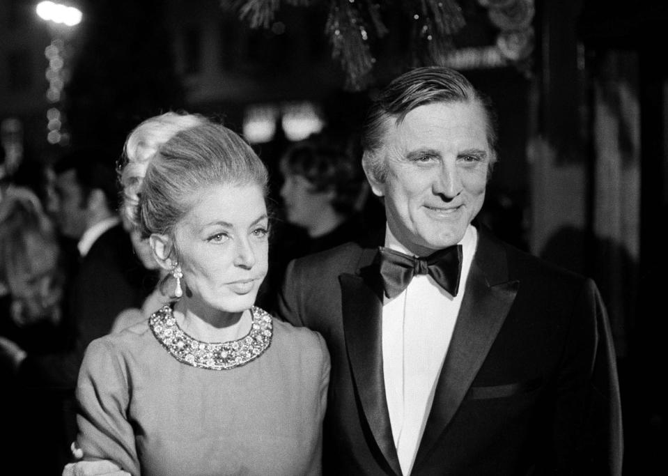 FILE - This Dec. 19, 1969 file photo shows actor Kirk Douglas and his wife, Anne, attending the premiere of "Hello Dolly" in Los Angeles. Kirk Douglas died Wednesday, Feb. 5, 2020 at age 103. (AP Photo/David F Smith, File)