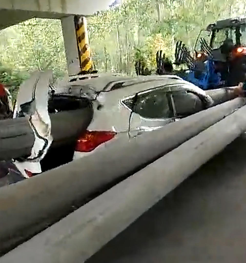 The pole entered through the windscreen and out through the car’s boot, ripping the door off in the process. Source: Australscope/ Asia Wire