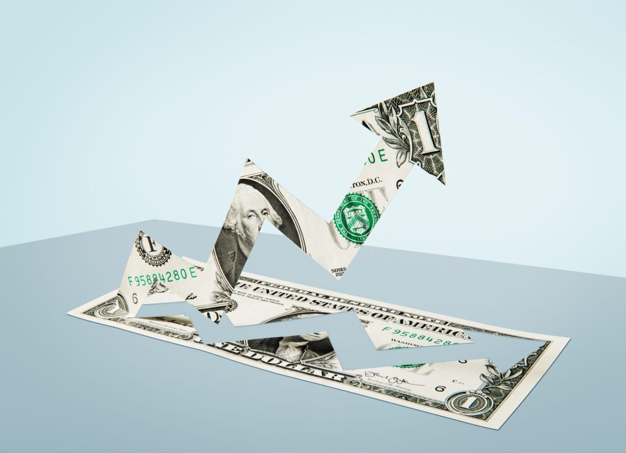 An image of a dollar bill in the shape of a successful growth business chart.