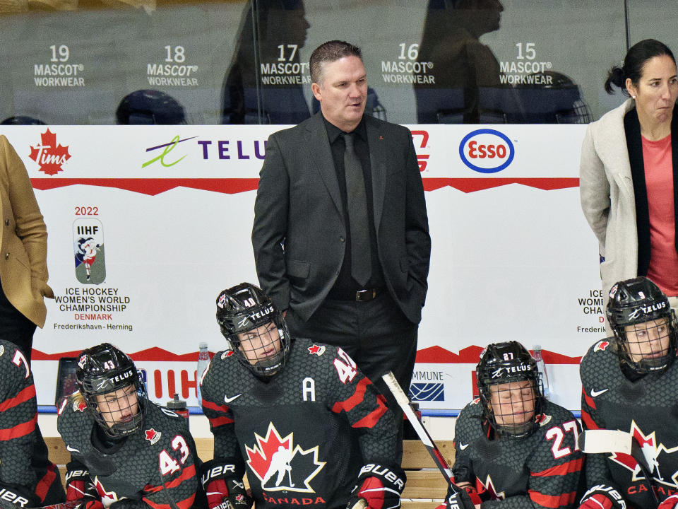 FILE - Canada Coach Ryan Troy looks on during the IIHF World Championship Woman's hockey semifinal match between Canada and Switzerland in Herning, Denmark, Saturday, Sept. 3, 2022. Ryan doesn't put much stock into the word "defending." It's not something Canada's coach emphasizes when it comes to the uptempo, highly aggressive push-the-puck style his players first introduced to women's hockey when winning gold at the 2022 Beijing Winter Games. So it's not something Ryan is going to stress despite the Canadians entering the world championships as two-time defending champions. (Henning Bagger/Ritzau Scanpix via AP, File)