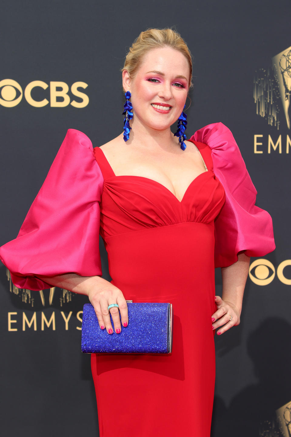 <p>While screenwriter Ariel Dumas may work behind the scenes, her makeup for tonight's Emmy Awards put her center stage. Her bright pink eyes and glossy red lip are simply unforgettable — and to keep the focus on her bold makeup, Dumas wore her hair pulled back. </p>