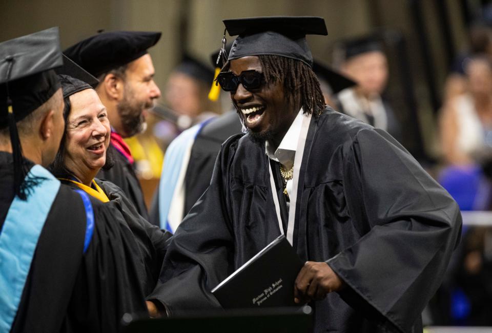 Justin Lewis celebrates graduating from Mariner High School at Alico Arena on Friday, May 17, 2024.