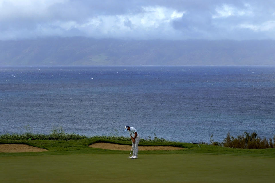 Rickie Fowler putts on the 12th green during third round of the Tournament of Champions golf event, Saturday, Jan. 4, 2020, at Kapalua Plantation Course in Kapalua, Hawaii. (AP Photo/Matt York)