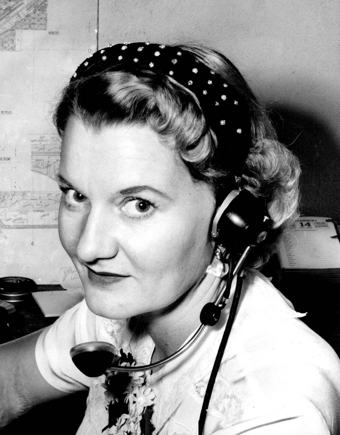 Thelma Nauman, a switchboard operator at Coral Gables City Hall in 1955, shows off a new and more comfortable headpiece.