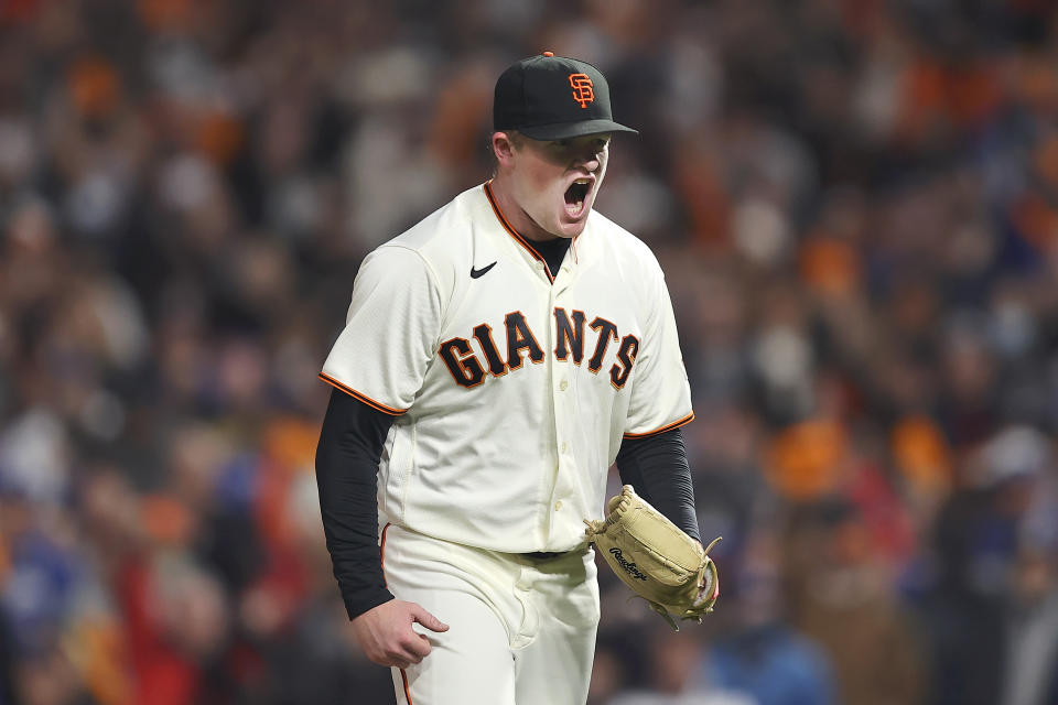 San Francisco Giants pitcher Logan Webb reacts after striking out Los Angeles Dodgers' Trea Turner during the sixth inning of Game 1 of a baseball National League Division Series Friday, Oct. 8, 2021, in San Francisco. (AP Photo/John Hefti)