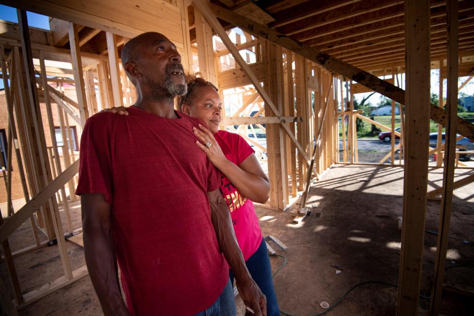 Sam and Tina Brown look at the progress of their home as they rebuild on Monday, Aug. 17, 2020 in Nashville, Tenn. A tornado ripped through the North Nashville neighborhood March 3, 2020 flattening Brown’s home early that morning.