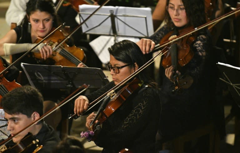 Mariel Chura goes to university in La Paz during the week, and goes home on weekends to play with the youth orchestra, which has players up to age 22