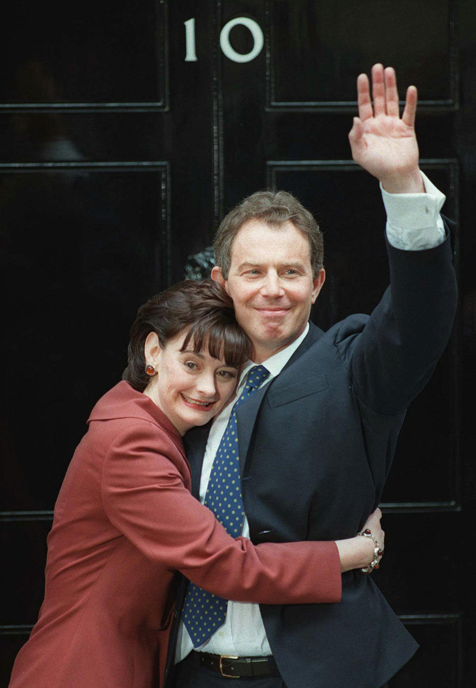 FILE - Britain's Prime Minister Tony Blair is hugged by his wife Cherie outside No. 10 Downing Street in London, May 2, 1997, shortly after his election win. The upcoming general election on July 4, 2024, is widely expected to lead to a change of government for the first time in 14 years. In 1997, the Labour Party had been out of power for longer than it has been now - 18 years - and it was quite a turnaround when Labour, under the leadership of the youthful Tony Blair, won the May 1, 1997 general election by a landslide majority of 179 seats. (AP Photo/Dave Caulkin, File)