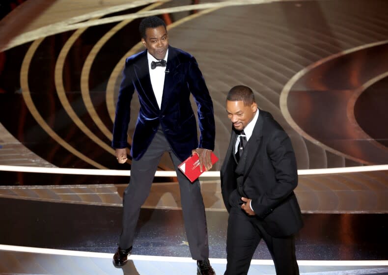 HOLLYWOOD, CA - March 27, 2022. Chris Rock and Will Smith onstage during the show at the 94th Academy Awards at the Dolby Theatre at Ovation Hollywood on Sunday, March 27, 2022. (Myung Chun / Los Angeles Times)