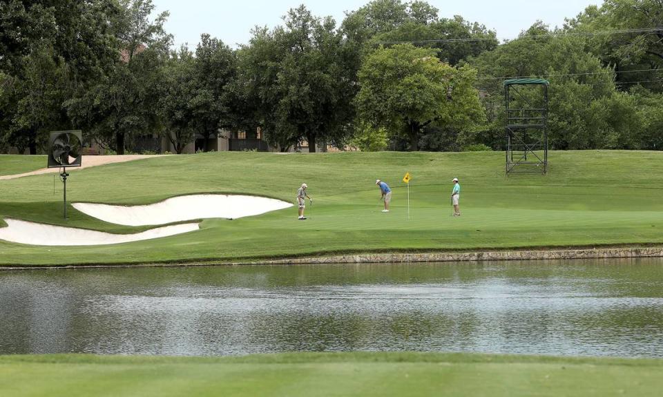 Golfers finish up on the green of the 13th hole at Colonial Country Club in this file photo from 2020. No. 13 is one of the best places for fans to watch the Charles Schwab Challenge.