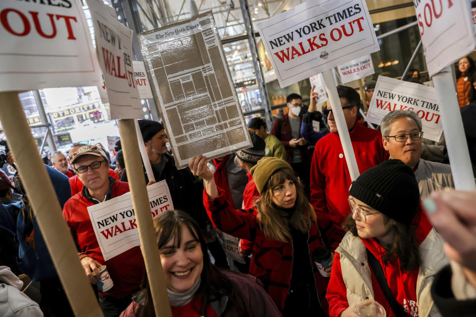 Hundreds of New York Times journalists and other staff protest outside the Times' office after walking off the job for 24 hours, frustrated by contract negotiations that have dragged on for months in the newspaper's biggest labor dispute in more than 40 years, Thursday, Dec. 8, 2022, in New York. (AP Photo/Julia Nikhinson)