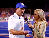 Boise State Broncos head coach Chris Petersen speaks with Samantha Steele after a game. (US Presswire)