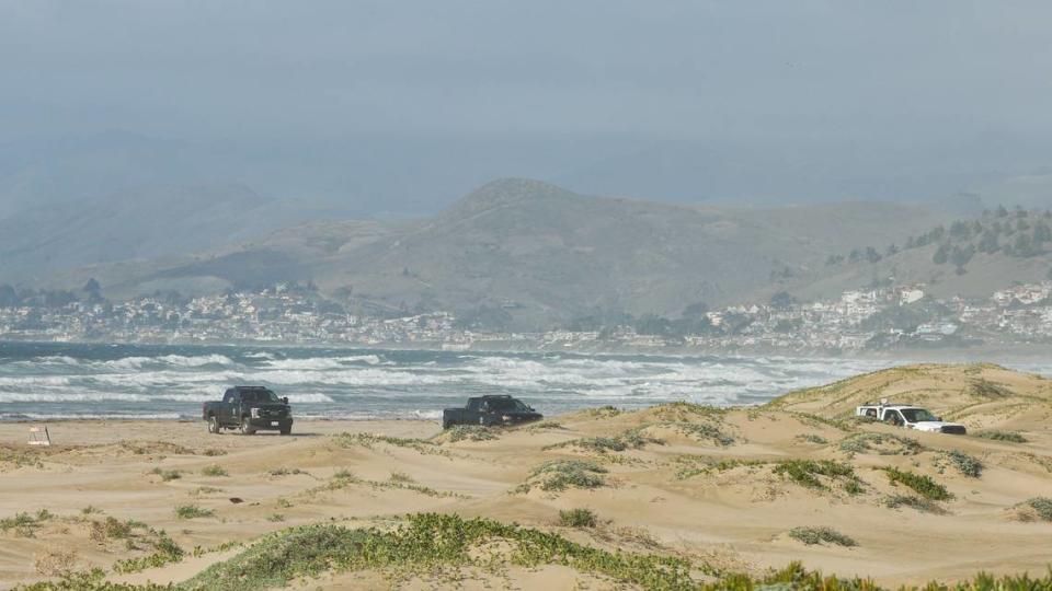 Investigators at the scene of a fatal shark attack north of Morro Rock. The water was closed Dec. 24, 2021.