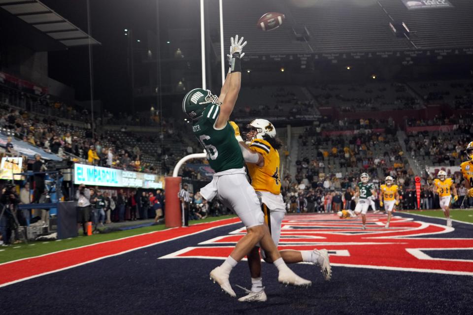 Dec 30, 2022; Tucson, AZ, USA; Ohio Bobcats tight end Tyler Foster (86) makes a game winning touchdown catch during overtime against Wyoming Cowboys safety Isaac White (42) in the 2022 Arizona Bowl at Arizona Stadium. Mandatory Credit: Joe Camporeale-USA TODAY Sports