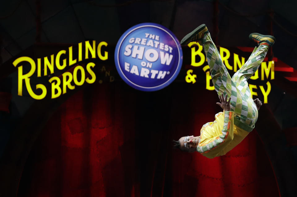 A Ringling Bros. and Barnum & Bailey clown does a somersault during a performance Saturday, Jan. 14, 2017, in Orlando, Fla. The Ringling Bros. and Barnum & Bailey Circus will end the "The Greatest Show on Earth" in May, following a 146-year run of performances. Kenneth Feld, the chairman and CEO of Feld Entertainment, which owns the circus, told The Associated Press, declining attendance combined with high operating costs are among the reasons for closing. (AP Photo/Chris O'Meara)