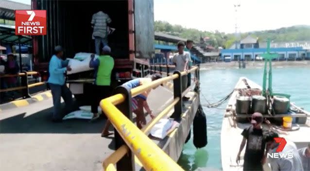 Authorities unloading the boat. Source: 7News