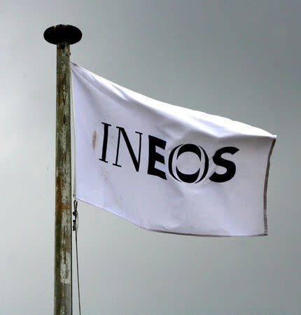 FILE PHOTO: An INEOS flag flies above an oil refinery building in Grangemouth, central Scotland April 28, 2008. REUTERS/David Moir/File Photo