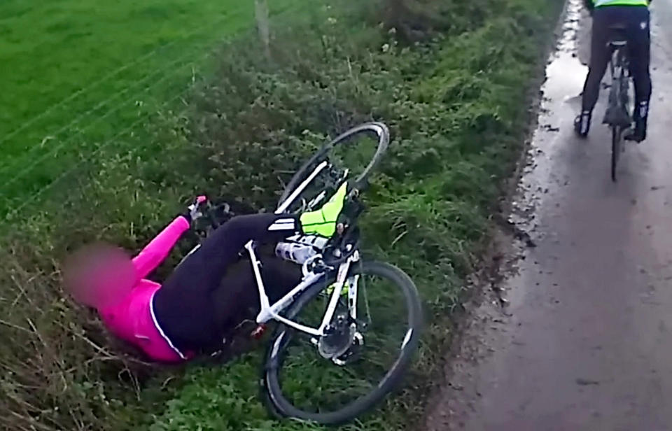 Footage showing a cyclist falling off her bike after a car drove past her on a country lane has divided opinion after the motorist was fined. (SWNS)