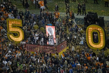 Feb 7, 2016; Santa Clara, CA, USA; Denver Broncos quarterback Peyton Manning celebrates with the Lombardi Trophy on the podium following their victory aCarolina Panthers 24-10 in Super Bowl 50 at Levi's Stadium. Mandatory Credit: USA TODAY Sports