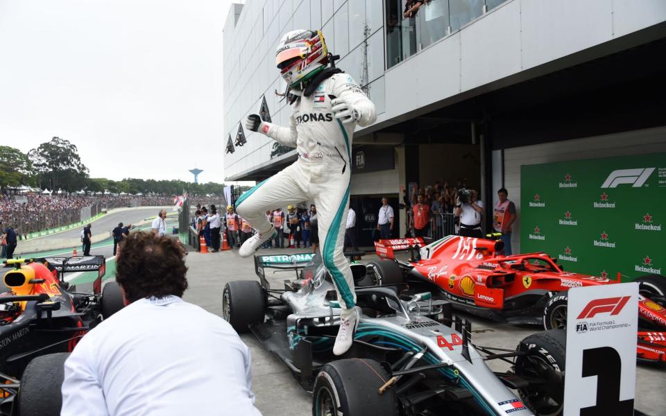 Lewis Hamilton took advantage of Max Verstappen's collision with Esteban Ocon to take victory in Brazil - AFP