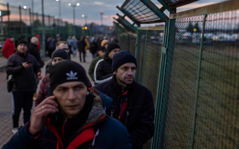 Ukrainian citizens are seen arriving at the Medyka pedestrian border crossing in eastern Poland