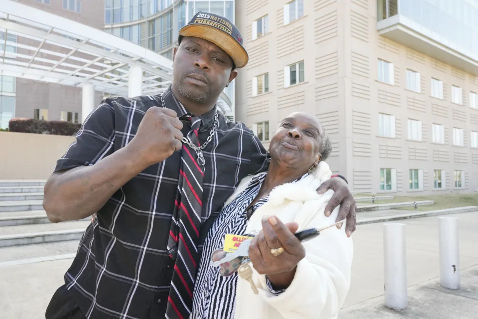 Eddie Terrell Parker and his aunt Linda Rawls express their joy at the 40-year prison sentence given former Rankin County sheriff's deputy Christian Dedmon by a federal judge, Wednesday, March 20, 2024, in Jackson, Miss. Dedmon was sentenced for his part in the racist torture of Parker and Michael Corey Jenkins by a group of white officers who called themselves the “Goon Squad”. (AP Photo/Rogelio V. Solis)