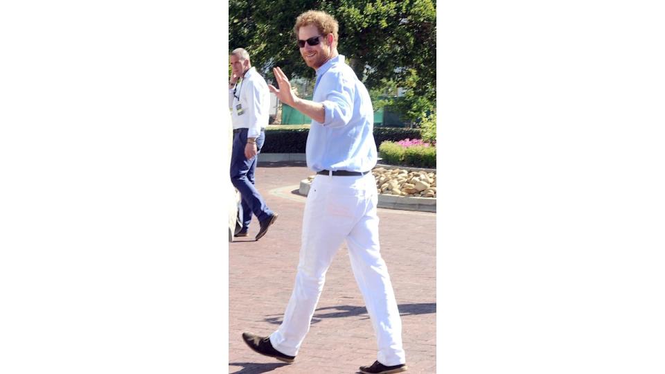 Prince Harry in a white outfit at a polo match