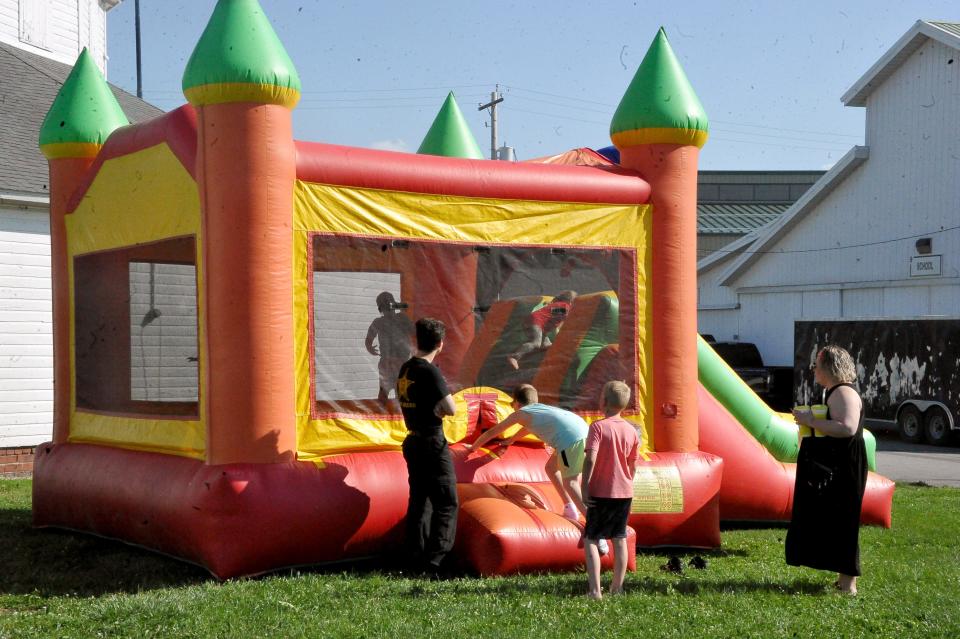 The bounce houses in kiddie land was a popular spot.