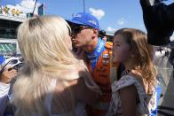 Graham Rahal is greeted by his family after qualifying for the Indianapolis 500 auto race at Indianapolis Motor Speedway, Sunday, May 19, 2024, in Indianapolis. (AP Photo/Darron Cummings)