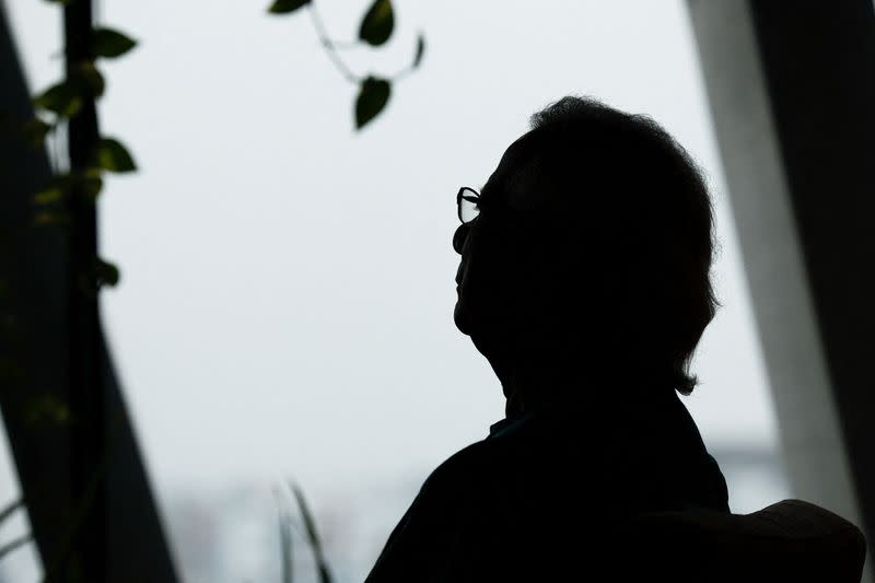 Bangladeshi Nobel peace prize winner Dr. Muhammad Yunus is silhouetted while sitting for an interview with Reuters in his office, in Dhaka