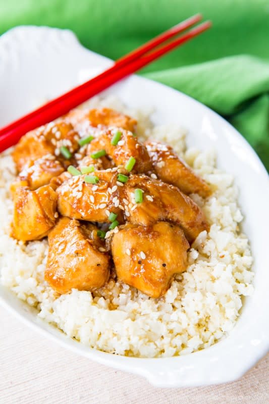 <p>Asian-inspired sweet ad tangy flavors make this dish better than takeout. Get this <a href="https://cupcakesandkalechips.com/slow-cooker-orange-sesame-chicken/" rel="nofollow noopener" target="_blank" data-ylk="slk:Slow-Cooker Orange Sesame Chicken;elm:context_link;itc:0;sec:content-canvas" class="link rapid-noclick-resp">Slow-Cooker Orange Sesame Chicken</a> recipe!</p>