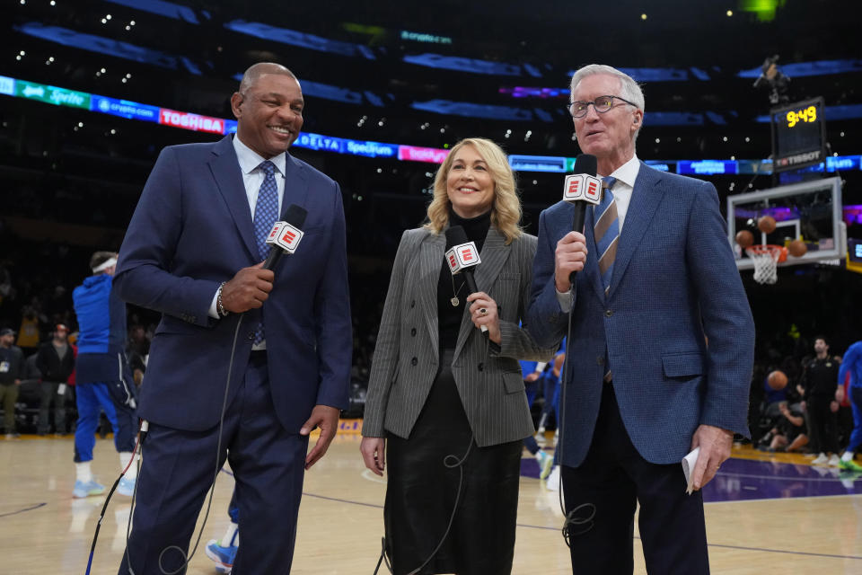 Jan 17, 2024; Los Angeles, California, USA; ESPN analysts Doc Rivers (left) and Doris Burke (center) and play-by-play announcer Mike Breen during the game between the Los Angeles Lakers and the Dallas Mavericks at Crypto.com Arena. Mandatory Credit: Kirby Lee-USA TODAY Sports
