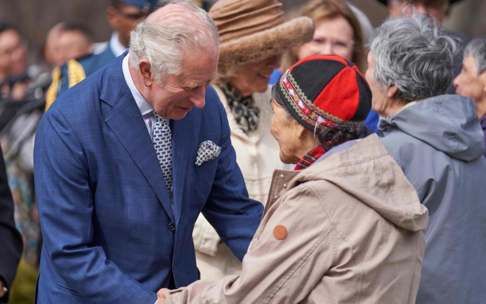 Prince Charles greets indigenous women during a ceremony in Heart Garden - GEOFF ROBINS 