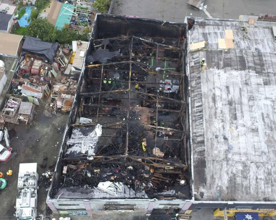 FILE - This undated file photo provided by the City of Oakland shows inside the burned warehouse after the deadly fire that broke out on Dec. 2, 2016, in Oakland, Calif. Two men who pleaded no contest to 36 charges of involuntary manslaughter will face the family members of those who died in a fire at an illegally converted Northern California warehouse. A two-day sentencing hearing for Derick Almena and Max Harris is scheduled to begin Thursday, Aug. 9, 2018, in Oakland. (City of Oakland via AP, File)