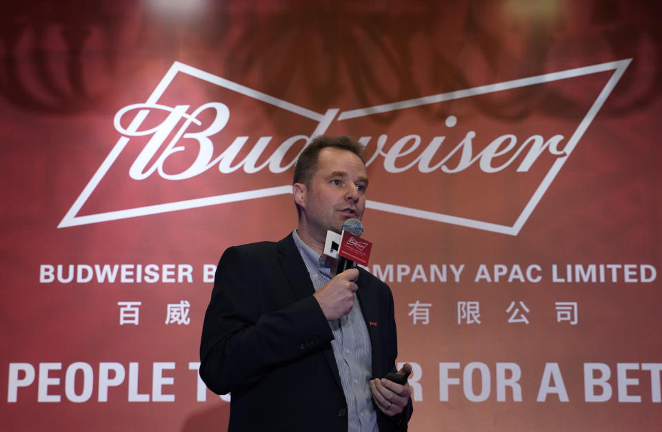 Jan Craps, Executive Director and CEO of Budweiser Brewing Company APAC Limited speaks during a press conference in Hong Kong, Tuesday, Sept. 17, 2019. AB InBev, the world's largest brewer that produces Budweiser and Corona, has revived plans to list its Asian business in Hong Kong despite persistent pro-democracy protests but halved the size of its initial public offering. (AP Photo/Vincent Yu)