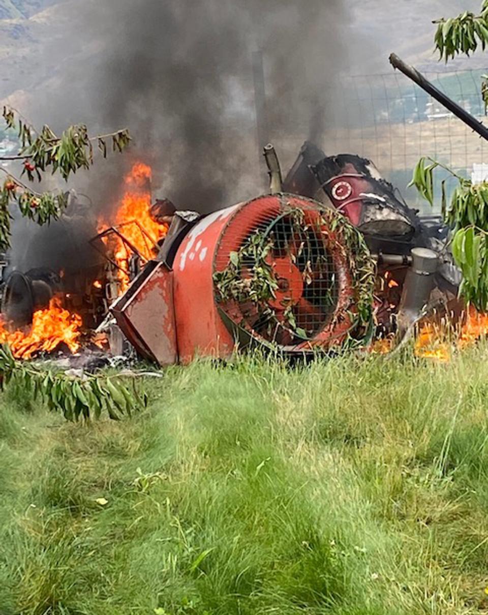 Firefighters found a helicopter wreckage in an orchard along with a tractor with both on fire