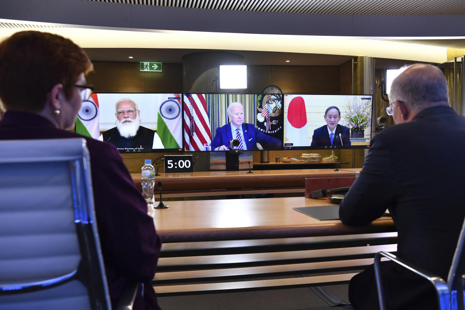 Australia's Prime Minister Scott Morrison, right, and Minister for Foreign Affairs Marise Payne, left, participate in the inaugural Quad leaders meeting with the President of the United States Joe Biden, the Prime Minister of Japan Yoshihide Suga and the Prime Minister of India Narendra Modi in a virtual meeting in Sydney, Saturday, March 13, 2021. Morrison said his first-ever meeting with President Joe Biden as well as the leaders of India and Japan will become an anchor of stability in the Indo-Pacific region. (Dean Lewins/Pool via AP)